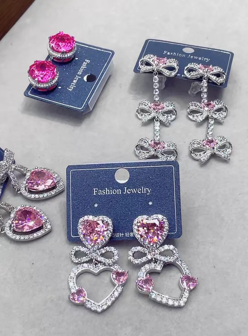 Pink heart and bow earrings from the product collection